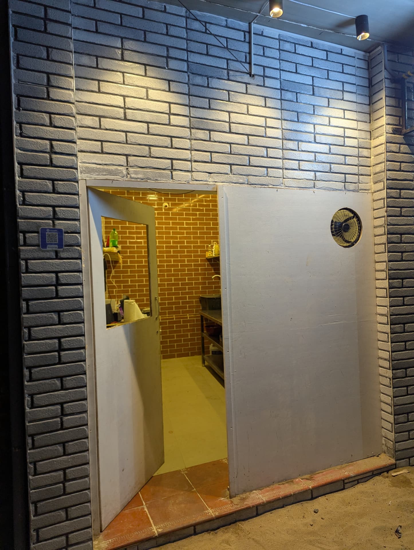 The entrance to Savory Delight with its charcoal brick facade